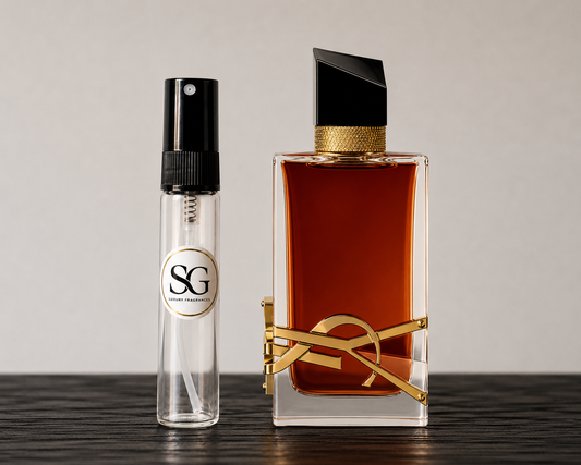 Two perfume bottles on a wooden surface with a neutral background