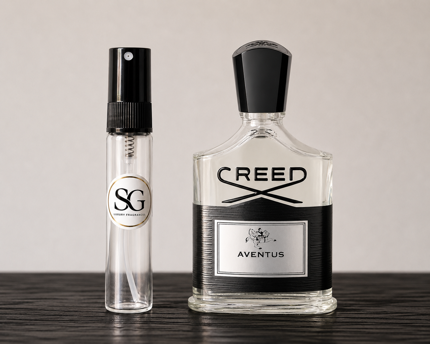 Two Creed perfume bottles on a wooden surface with a neutral background