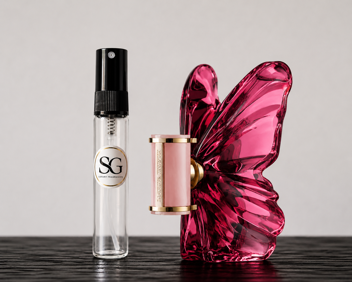 Perfume bottle with a butterfly-shaped pink container on a dark surface