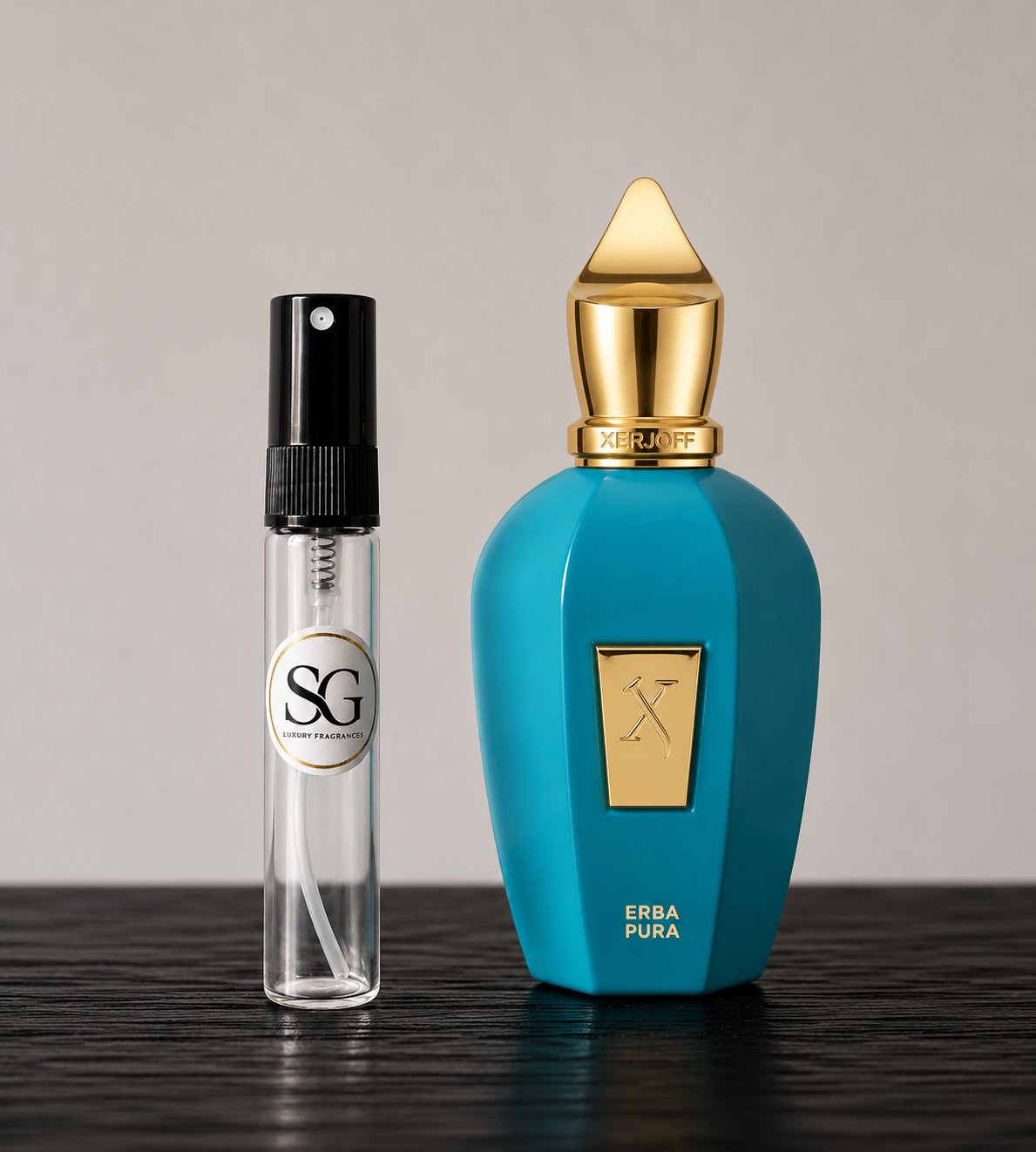 Two perfume bottles, one blue with a gold cap and the other clear with black cap, on a dark surface.
