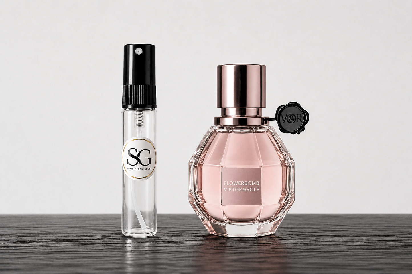 Two perfume bottles on a wooden surface with a white background